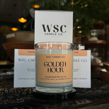 Load image into Gallery viewer, WSC Candle Co candle labeled 'Golden Hour' on a wooden surface with a blurred background
