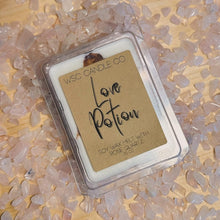 Load image into Gallery viewer, Wax melt clamshell with rose quartz in the background scented in Love Potion
