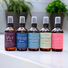 Load image into Gallery viewer, Five bottles of WSC Candle Co room spray with different scents on a white surface.