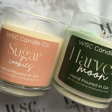 Load image into Gallery viewer, Two candles from WSC Candle Co on a branded background
