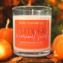 Load image into Gallery viewer, WSC Candle Co. Pumpkin &amp; Caramel Swirl candle with pumpkins and leaves in the background
